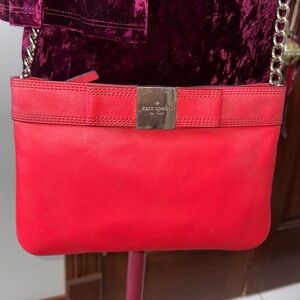 Kate Spade   Crossbody bag  leather orangeish red   bow on front chain strap det
